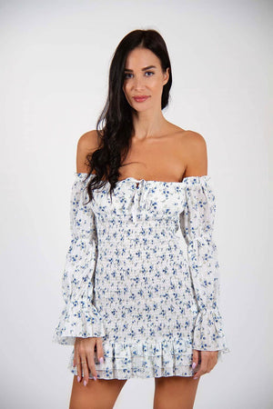 Dreamer Dress - Off-shoulder floral print mini dress, trendy and sleeveless. Model posing for front view