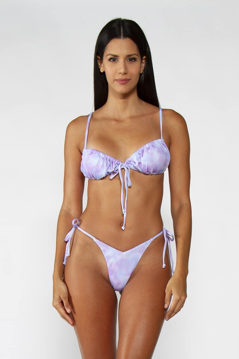Two-piece swimwear in a mix of pastel blue and purple color, model posing for frontal view