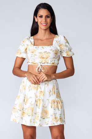 Piña Colada Set - Model wearing trendy two piece set with floral print, in frontal pose
