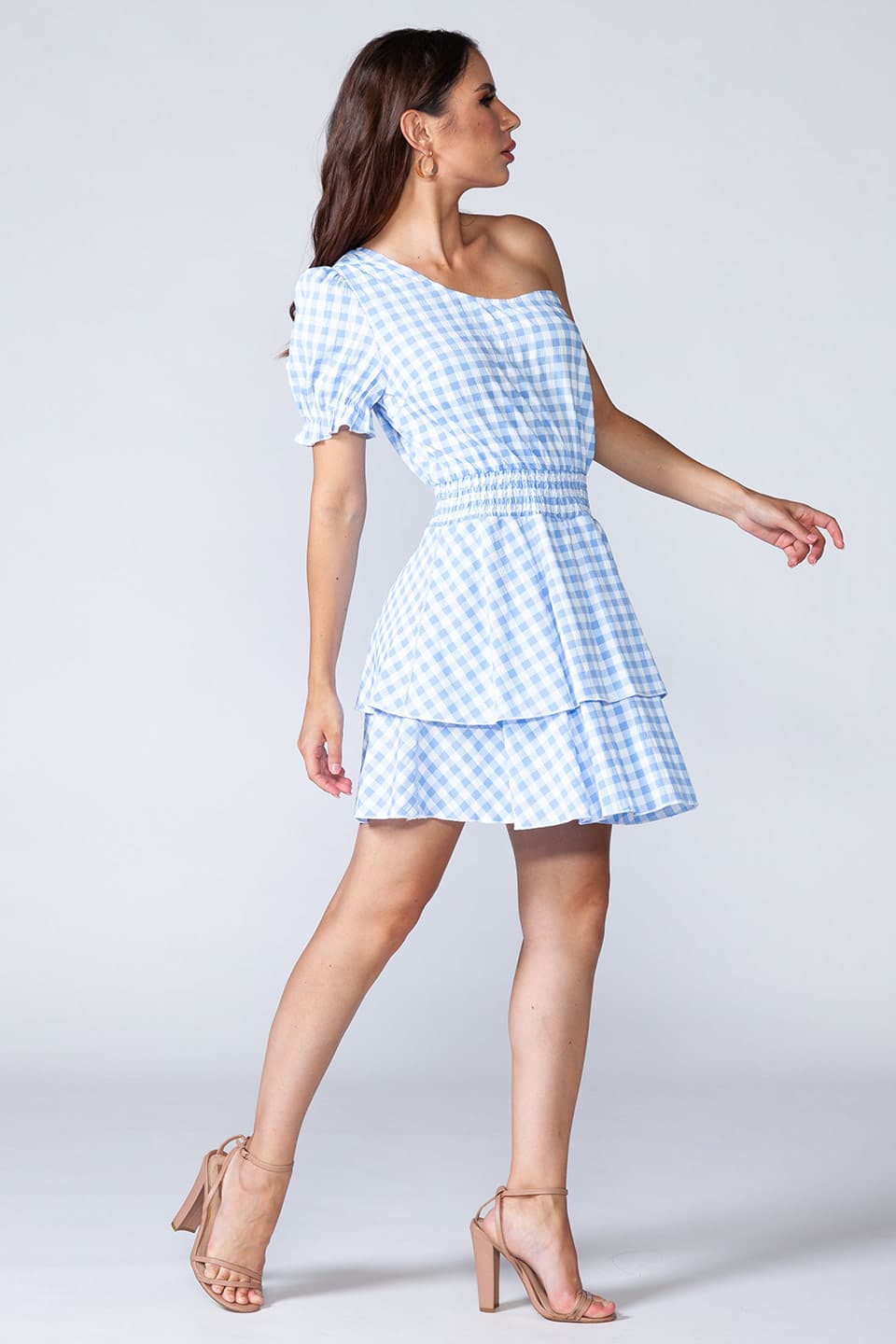 Blue flamenco, one shoulder mini dress in light blue and white, model in movement