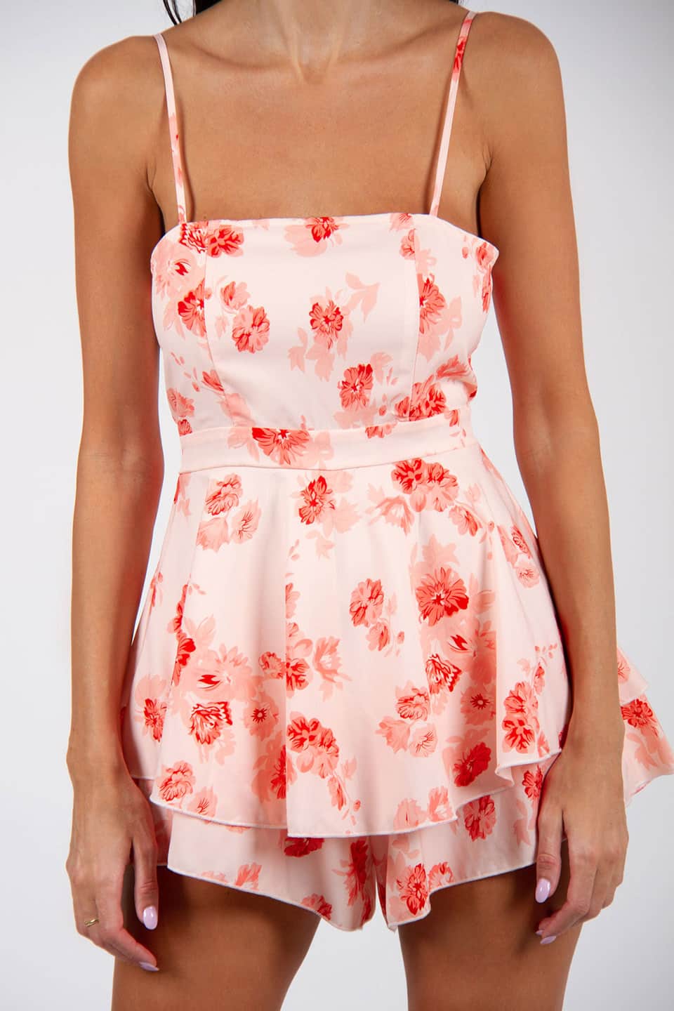 New floral print playsuit, in white and red colors. Details view