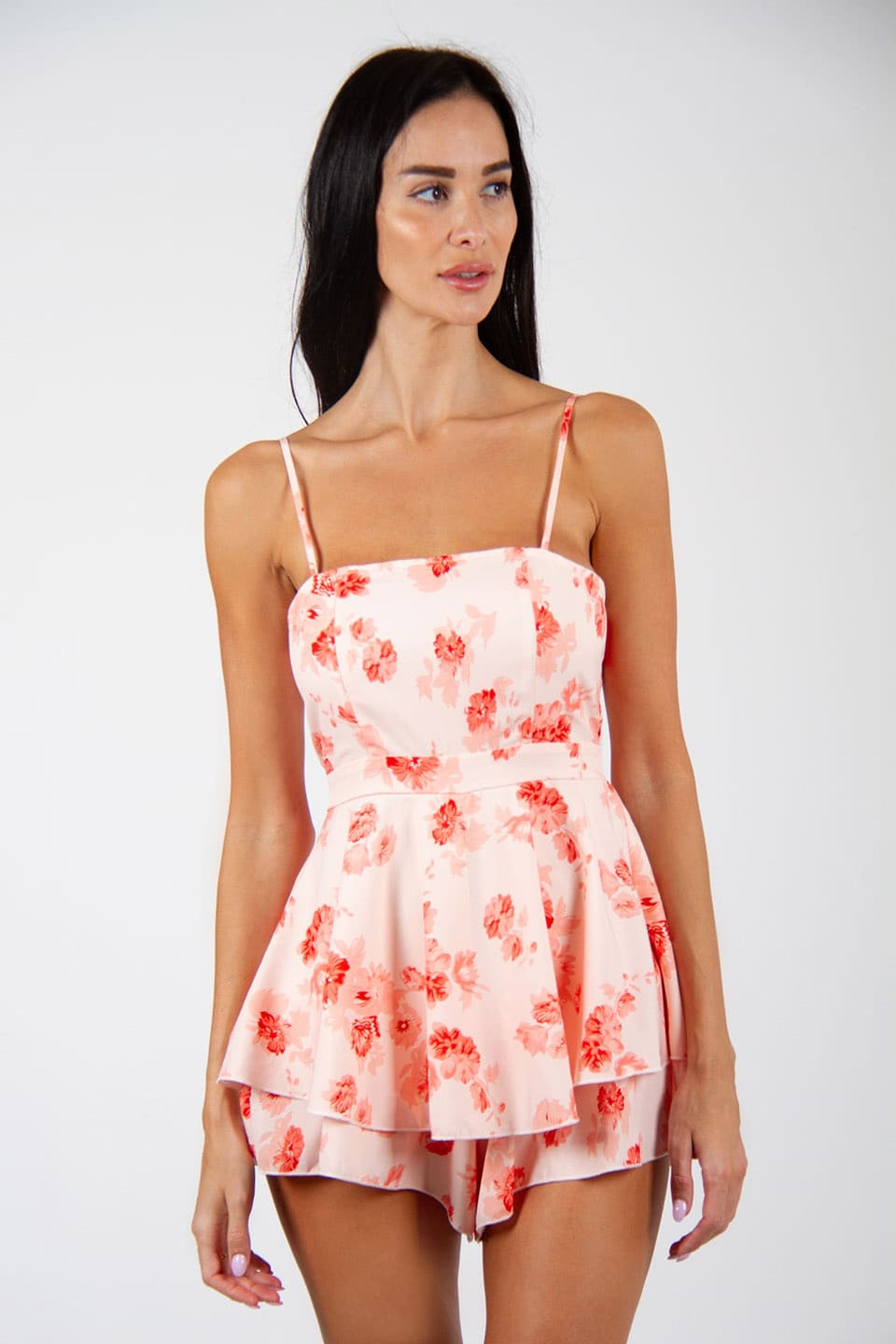 New floral print playsuit, in white and red colors. Model posing for front view