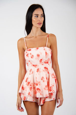 Fierce Playsuit - New floral print playsuit, in white and red colors. Model posing for front view