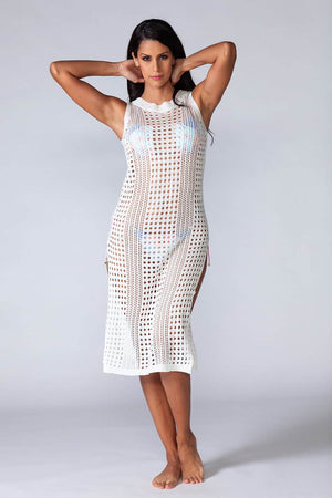 Hera Beach Dress White - Hollowed-out kaftan in white color, sleeveless and stretchable. Model posing natural
