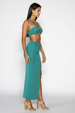 Jasmine Set - Top and skirt in Green color and stretchable material. Model on side view