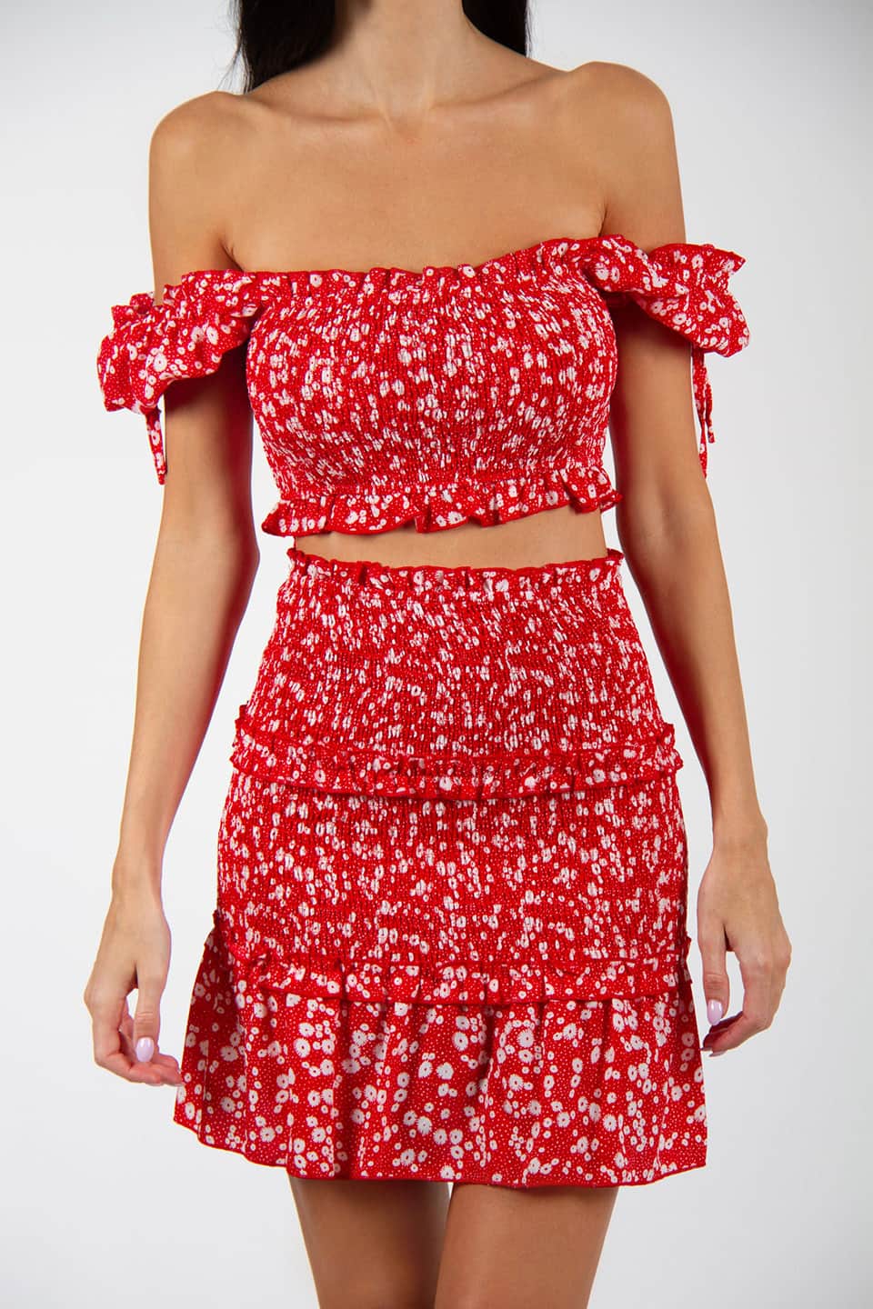 Model wearing flower print skirt and stretchable top. Texture and off-shoulders details