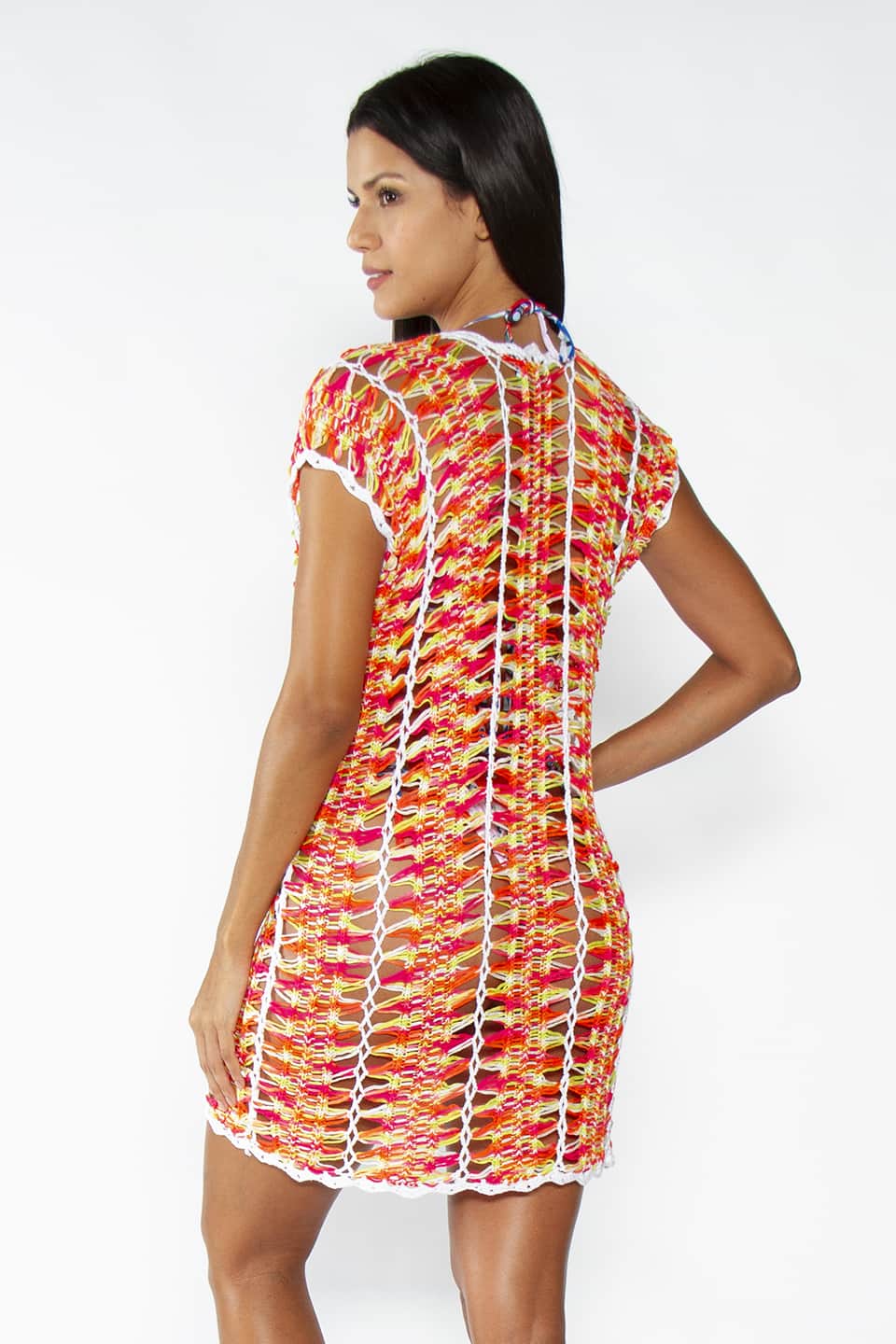 Crochet kaftan in neon colors, model posing from behind