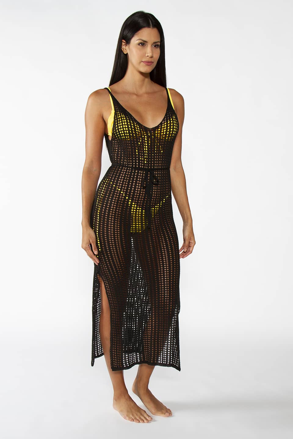 Kaftan beach dress in black color with open back and belt around the waist. Model posing for front view