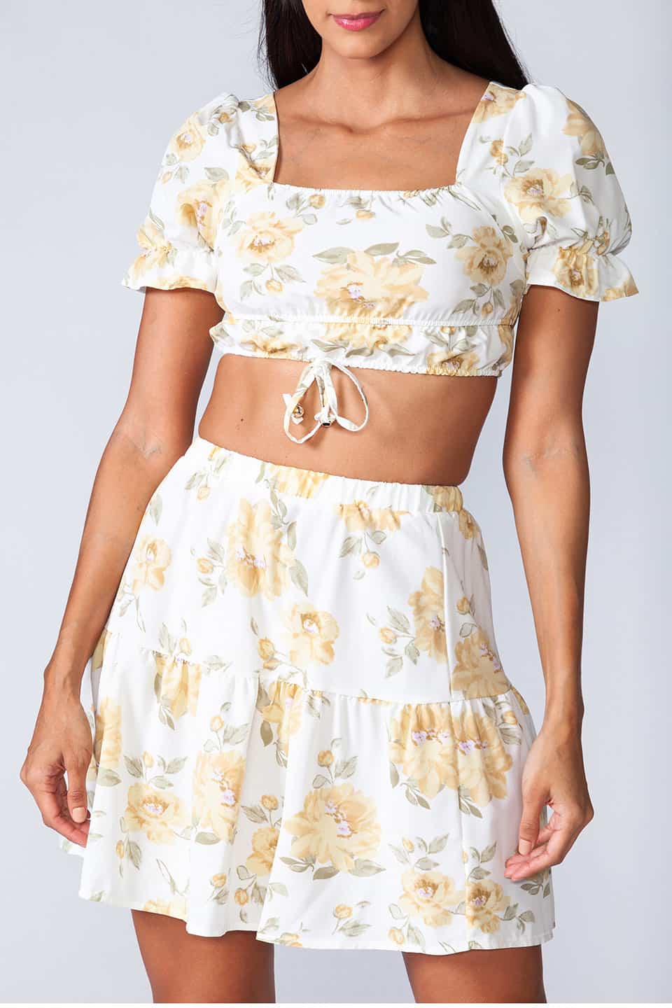 Model wearing trendy two piece set with floral print, texture details