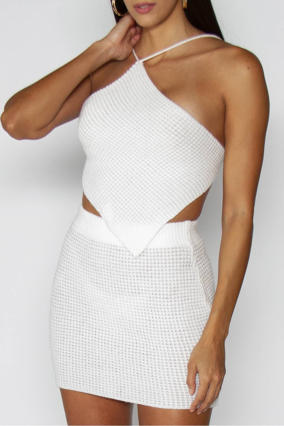 Retro style knitted top and skirt in white color. Zoom on material details