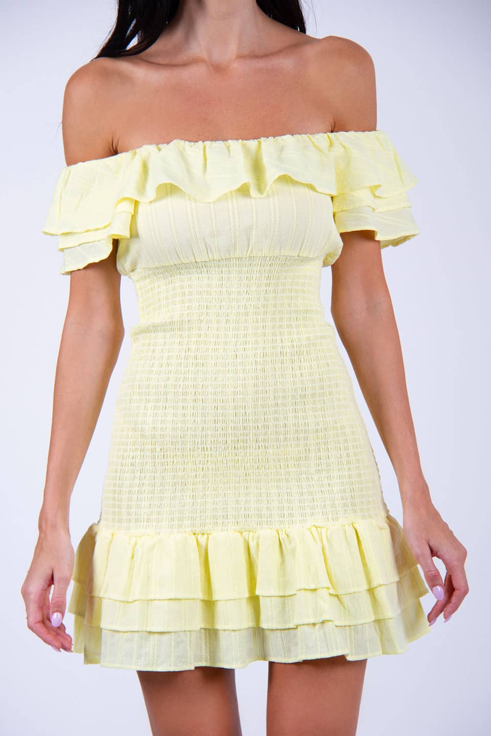 Model wears off-shoulder elasticated dress in yellow color, texture details