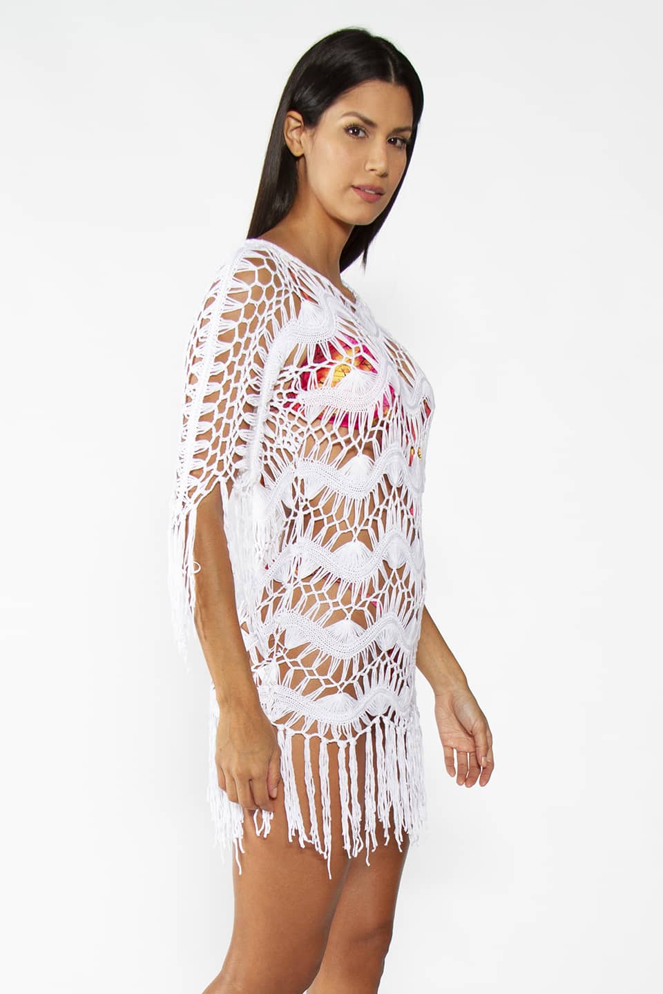 Model wearing Crochet Bohemian Cover up with fringe in White color, posing for side view