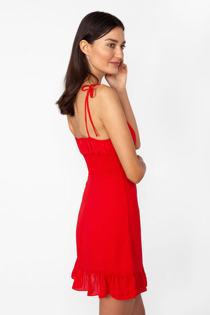 Valentine dress - Model wears short dress in red color and adjustable self-tie straps, in a natural pose