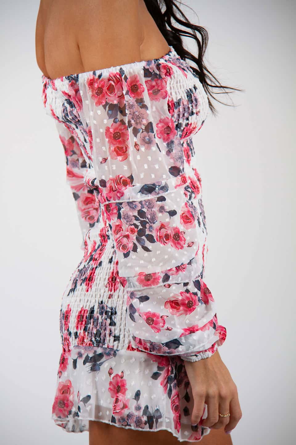 Model wearing off-shoulder floral print bodycon mini dress with long puff sleeves, with texture details